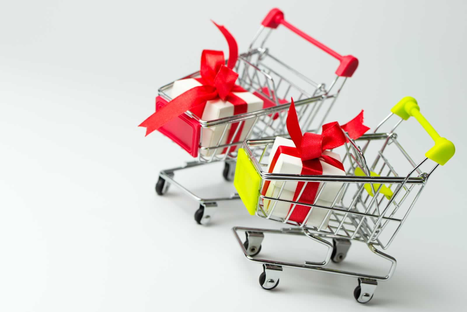 Red gift or presents box in a shopping cart, for sales promotion and rewards concept